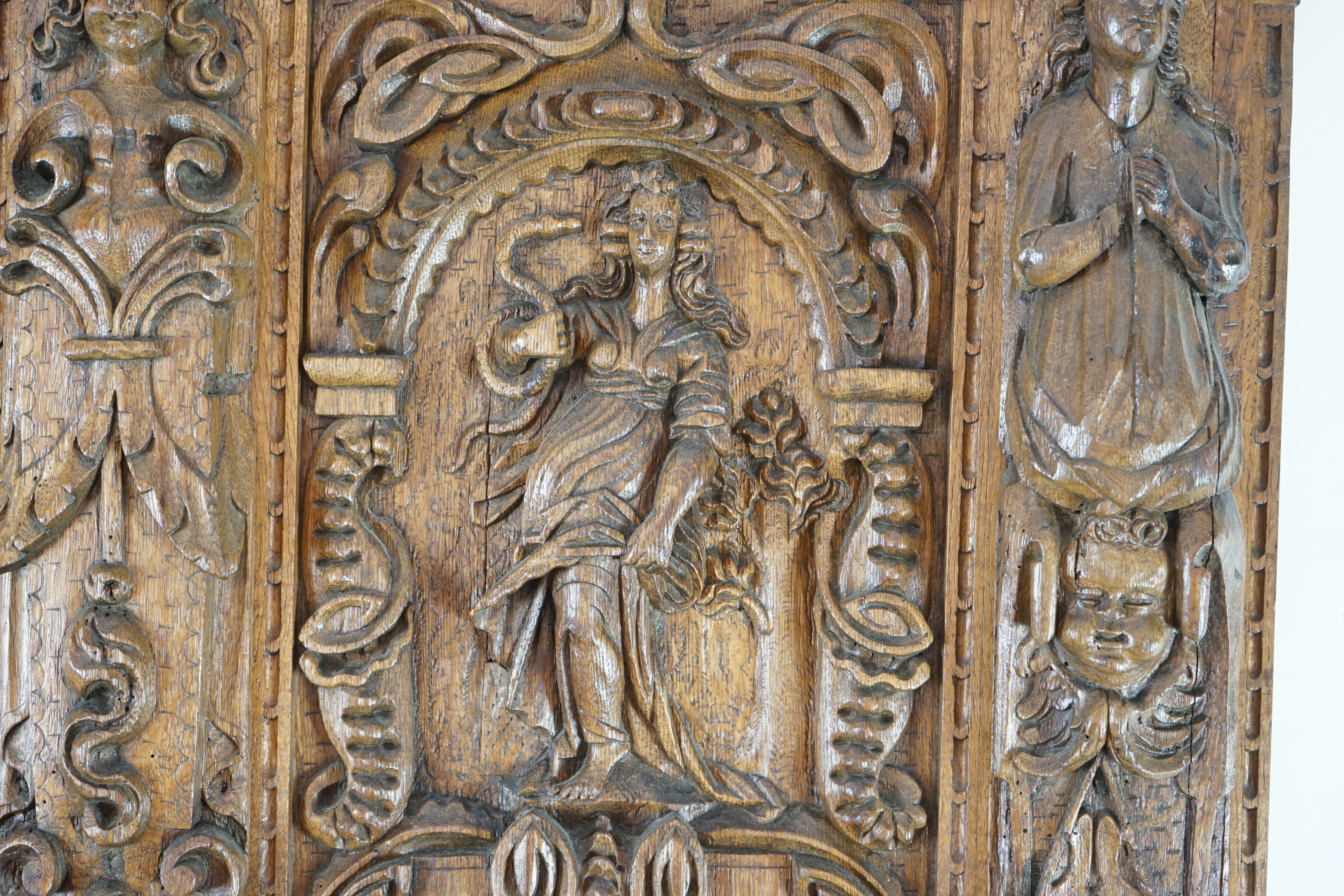 A 17th century and later Flemish carved oak panel